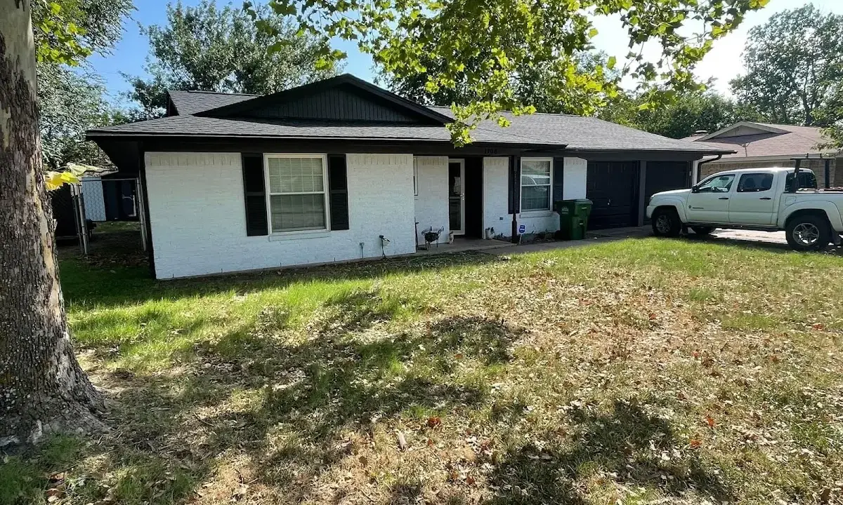 Professional roofing crew working on a residential roof in New Square